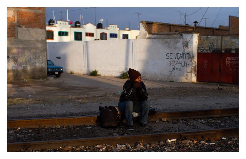 Reynosa, Tamaulipas. 23 October 2012. A woman waits for the train by the tracks. The train will get her to the Mexican border with the United States. Around here there are no big groups of immigrants, the only ones left are those who managed to survive all the way from the southern border.