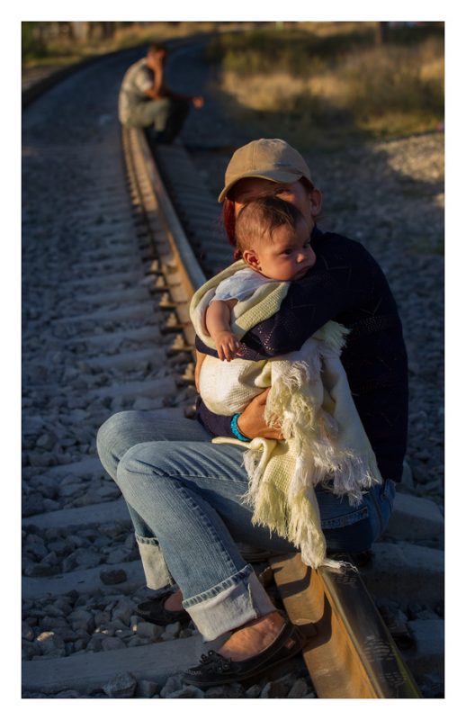 Tequisquiapan, estado de México. 26 October 2012. Sheyla, only accompanied by her newborn son, waits for the train that will take them to the northern border of Mexico.